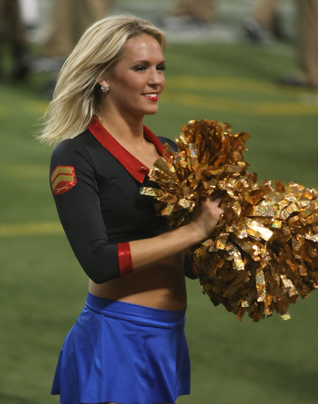 A Minnesota Vikings cheerleader wears a military costume as she