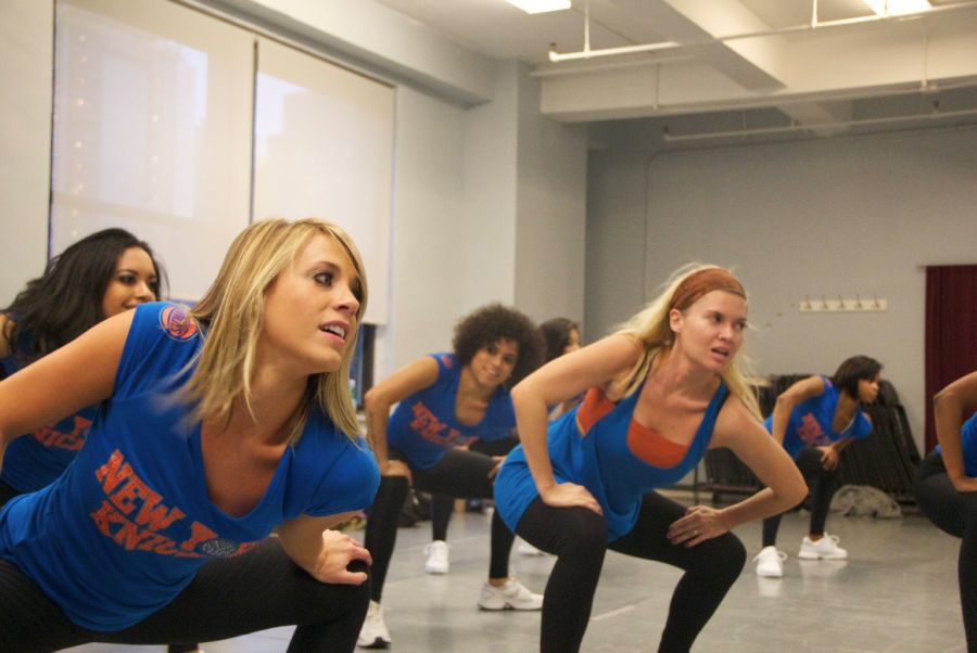 Author Randi Newton, center, tries to keep up with the real Knicks City Dancers