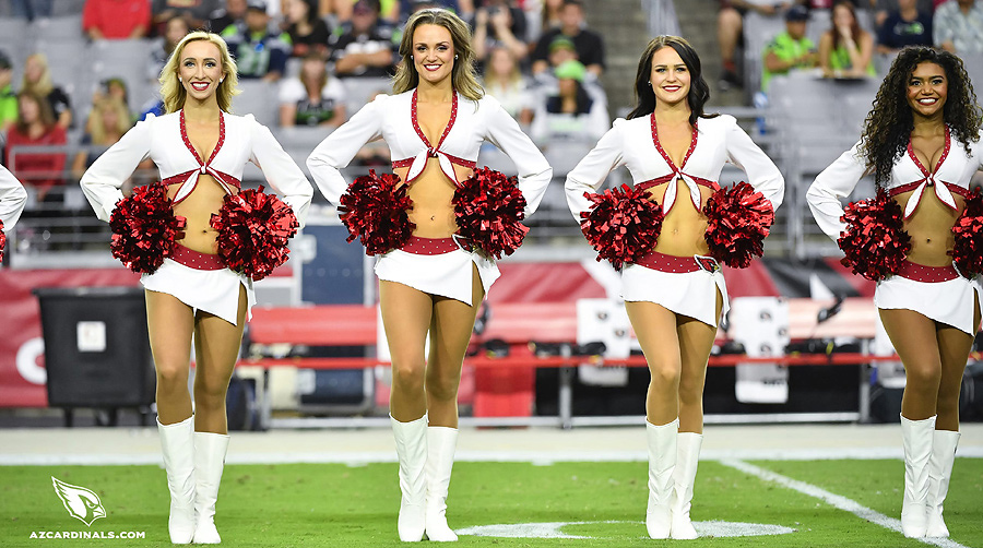 Arizona Cardinals' cheerleaders do a high kick at the Cardinals