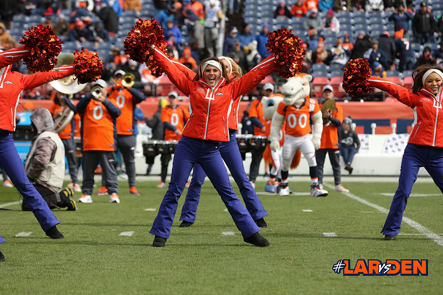 The Denver Broncos cheerleaders wear green to celebrate the NFL's